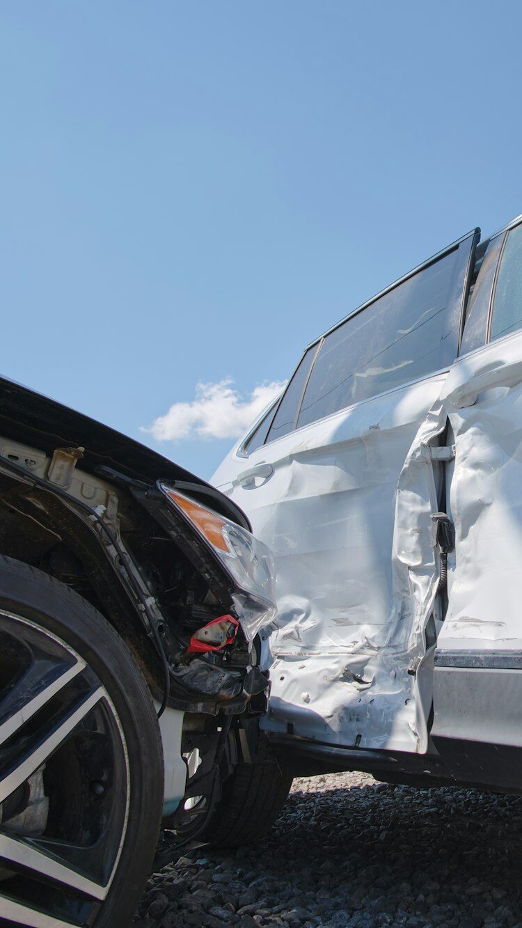 Cars crashed heavily in road accident after collision on city street.