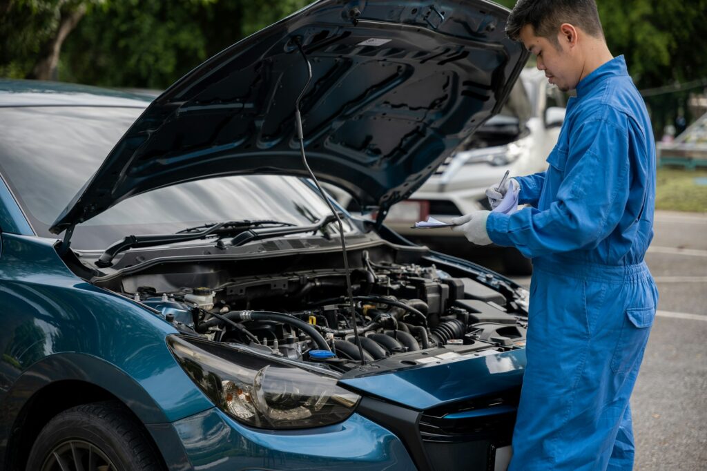 Mechanic repairing car